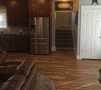 Beautiful hardwood flooring in kitchen by Gundersen's